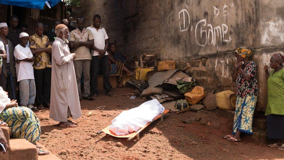 A body waits to be received by officials