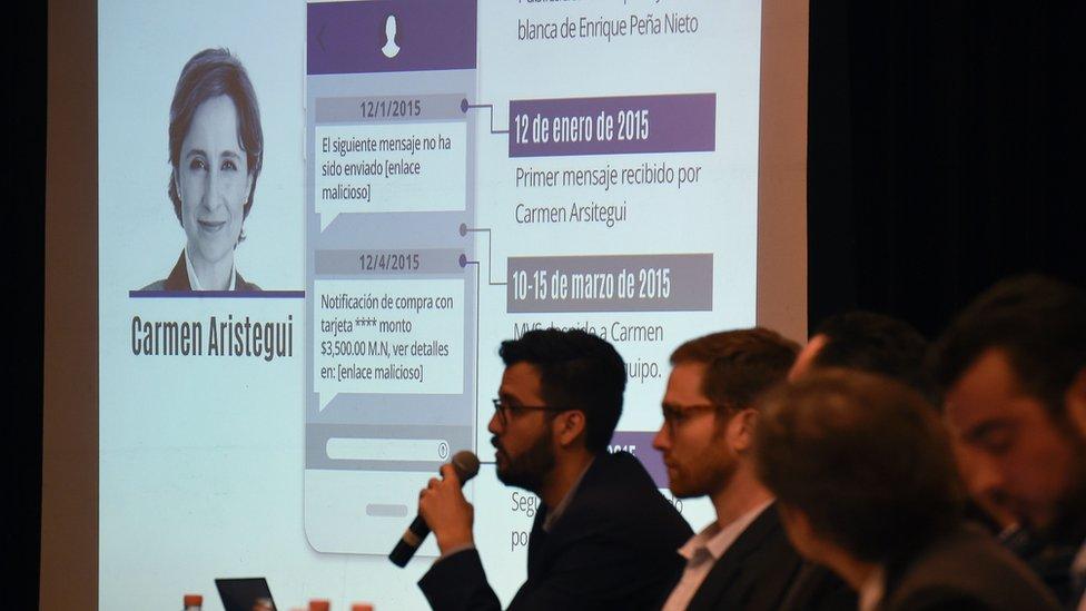 Information on Mexican journalist Carmen Aristegui is displayed on a screen during a journalists' press conference in Mexico City on June 19, 2017