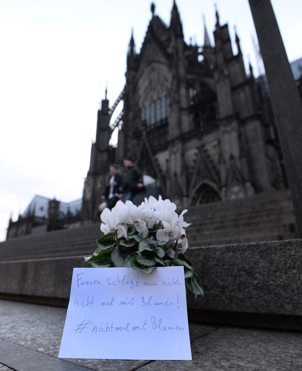 Flowers left outside the cathedral with a note