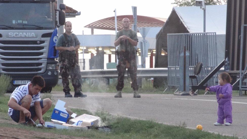 Asylum seekers at Kelebia, Serbia, waiting to enter the Transit Zone in the Hungarian fence, 12 September 2016