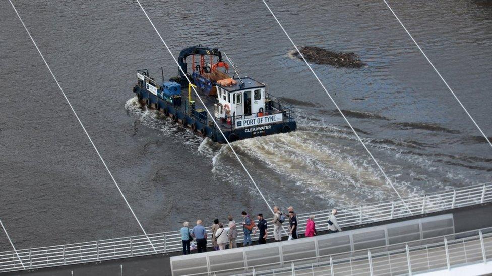 Boat working on the river