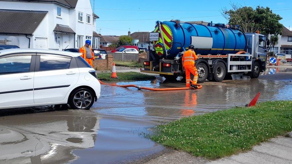 A tanker arrives to pump out water