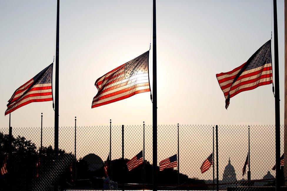 Flags fly at half-staff in honour of Senator John McCain at the Washington Monument in Washington, 26 August 2018