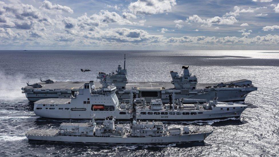 A view of HMS Queen Elizabeth, tanker RFA Tideforce and Type 23 frigate HMS Northumberland in the sea