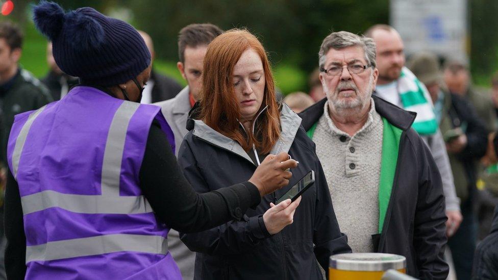 checking vaccine passport outside Celtic Park