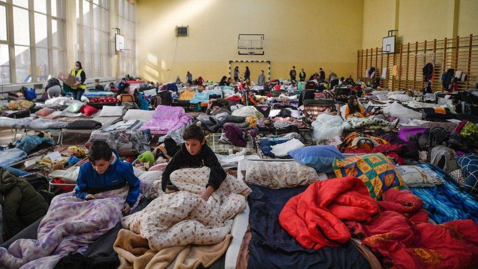 Children rest in a temporary shelter for Ukrainian refugees in a school in Przemysl, near the Ukrainian-Polish border