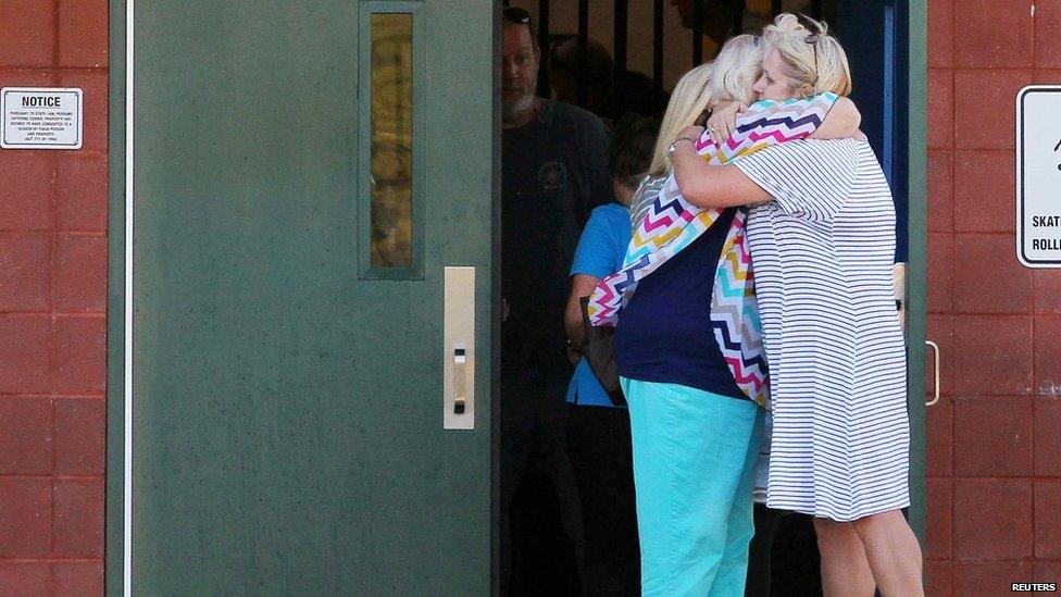 Teachers hug outside Townville Elementary School on 28 September 2016