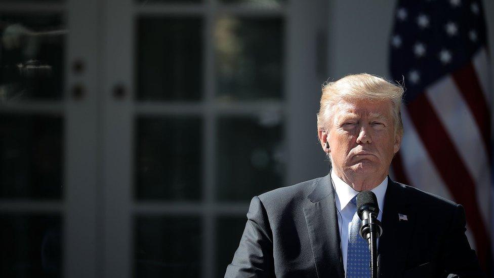 US President Donald Trump listens to Greek Prime Minister Alexis Tsipras during a joint press conference in the Rose Garden at the White House