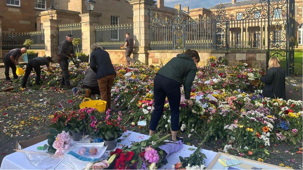 Flowers being moved