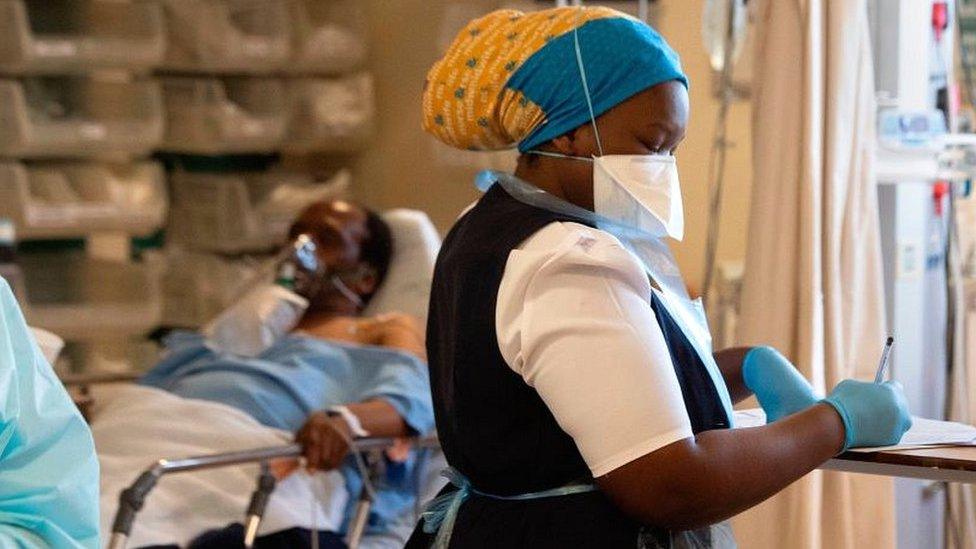 Medic writing notes at hospital near Cape Town.