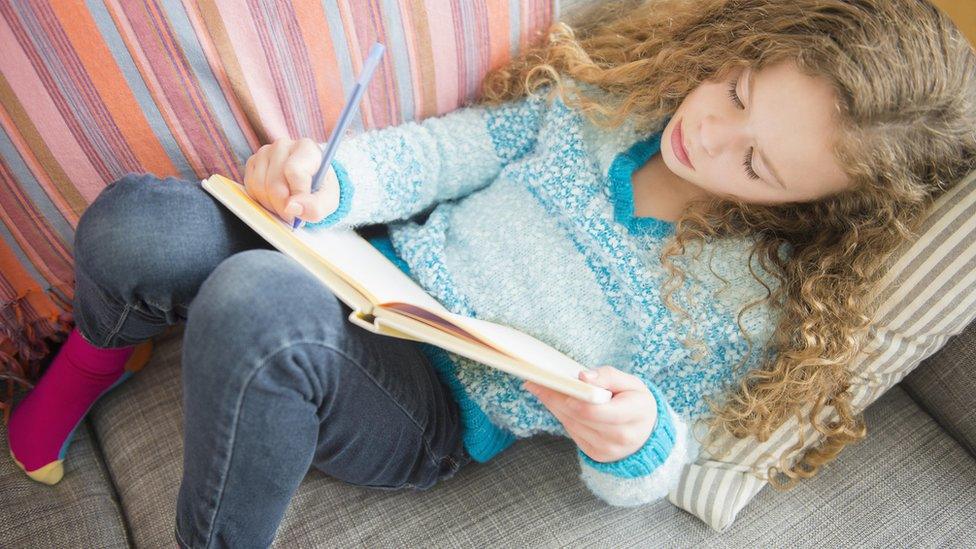 Girl writing in diary