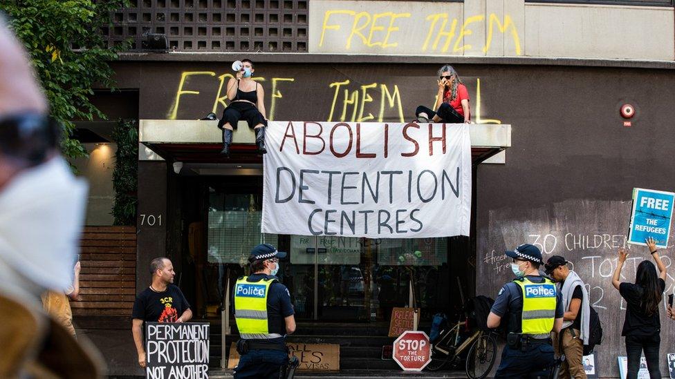 Activists in support of refugees gather outside Park Hotel on January 06, 2022 in Melbourne, Australia.