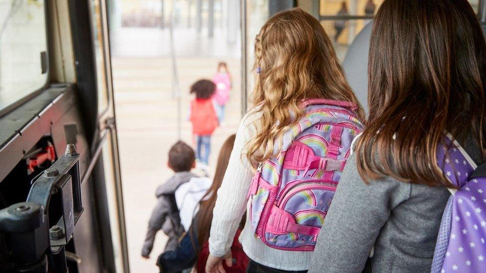 Pupils getting off school bus