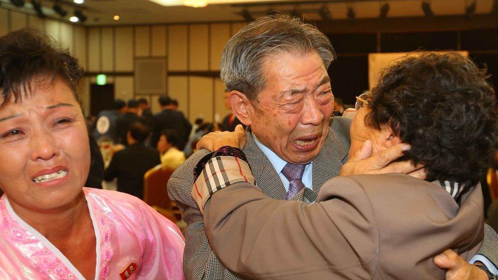 South Korean Min Ho-Sik (C), 84, hugs his North Korean relative Min Eun-Sik (R), 81, during a separated family reunion meeting at the Mount Kumgang resort on the North"s southeastern coast on October 20, 2015.