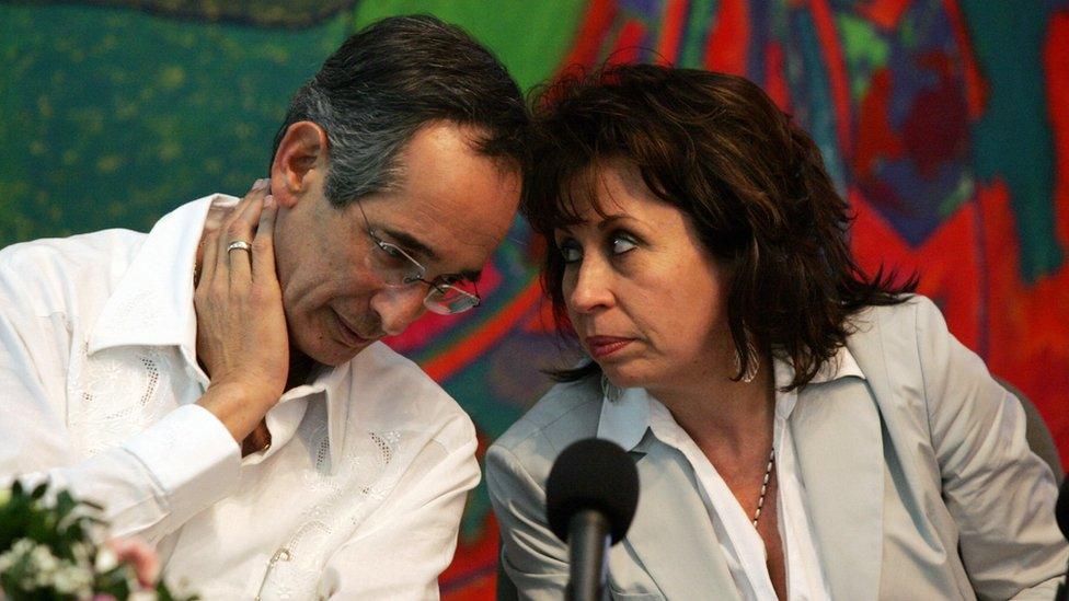 Guatemala's President elect Alvaro Colom listens to his wife Sandra Torres on 7 December 2007 in Managua.