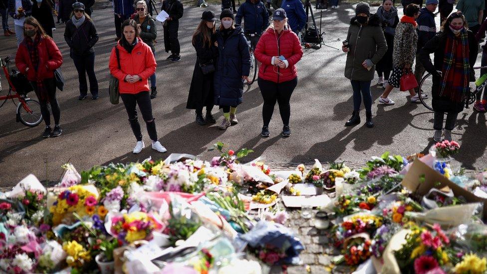 People gather at the memorial