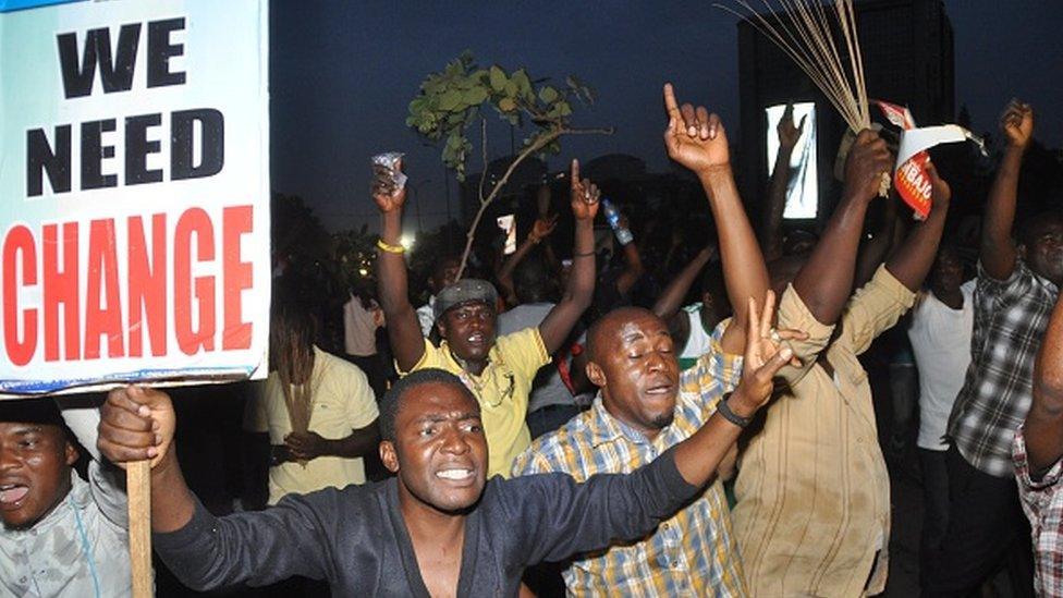 Youths celebrate on March 31, 2015 the victory of main opposition All Progressives Congress (APC) presidential candidate Mohammadu Buhari in Abuja