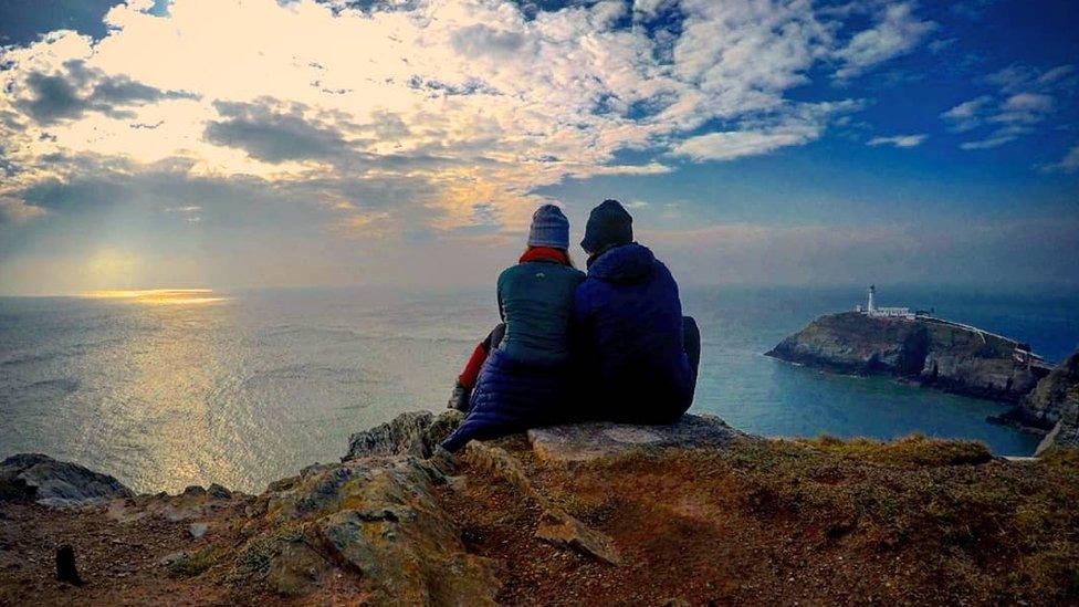 A couple admire the view at South Stack, Anglesey