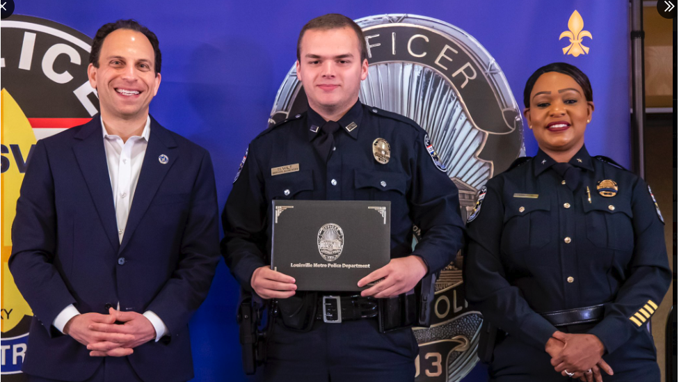 Officer Wilt (centre) was sworn in by the mayor and police chief two weeks ago