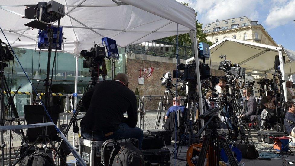 Journalists are waiting in front of the Palais Coburg where talks are being held. 10 July 2015