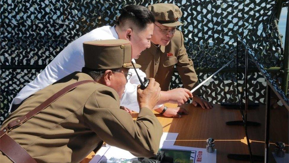 This undated picture released from North Korea's official Korean Central News Agency (KCNA) on September 20, 2016 shows North Korean leader Kim Jong-Un (C) inspecting the ground jet test of a new type high-power engine of a carrier rocket for the geo-stationary satellite at the Sohae Space Center in North Korea.