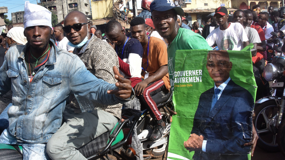 Supporters of Cellou Dalein Diallo on motorbikes in Guinea