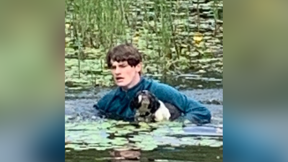 Connor bringing Charlie out of the water