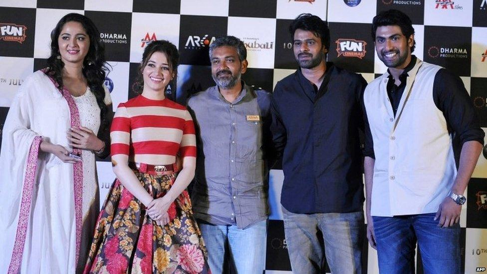 Bollywood actresses Anushka Shetty (L) and Tamannaah Bhatia (2L) pose with writer and director SS Rajamouli (C) and actors Prabhas (2L) and Rana Daggubati (L) as they attend the trailer launch of their forthcoming film Baahubali