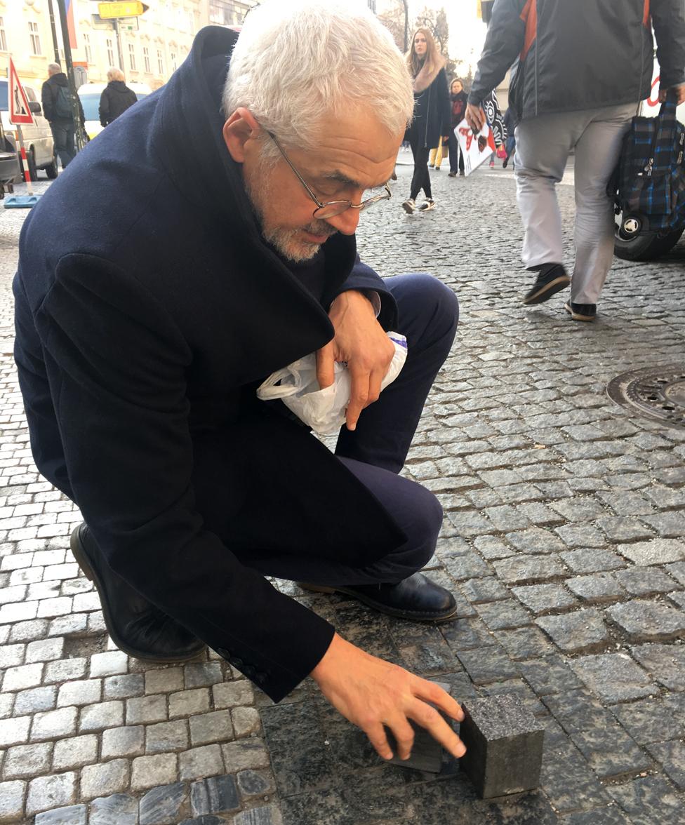 Leo Pavlat with his cobblestones made from gravestones