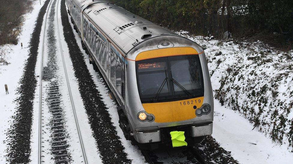 A train operates in icy conditions from High Wycombe to London