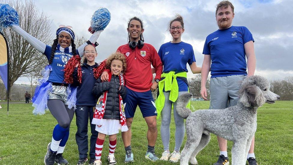 Competitors at the joint Bristol Rovers and Bristol City at Blaise Castle smile at the camera