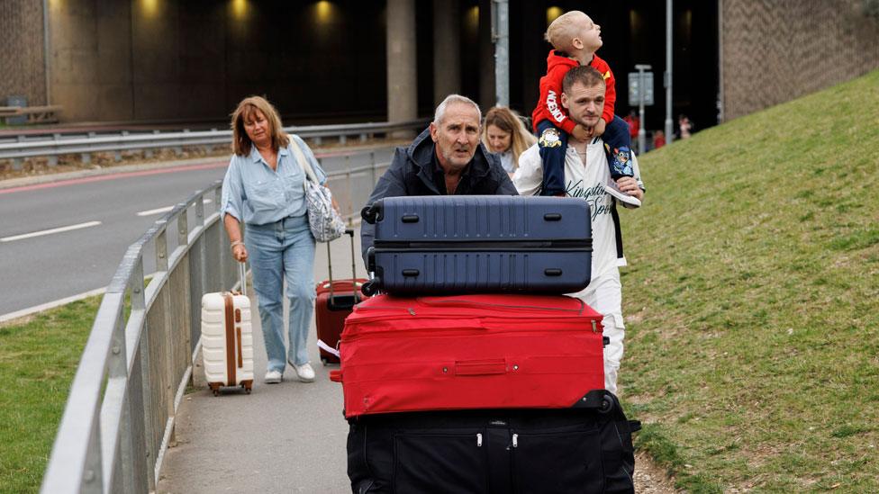 Passengers arriving at London Luton Airport on foot