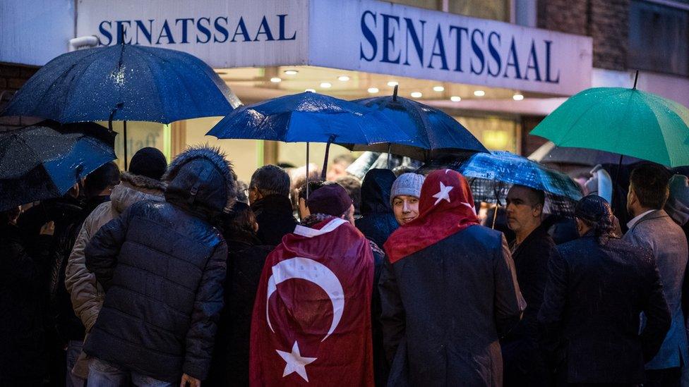 Expatriate Turks attend an event organised by the Turkish AKP, the political party of Turkish President Recep Tayyip Erdogan, in Cologne, Germany, 5 March 2017