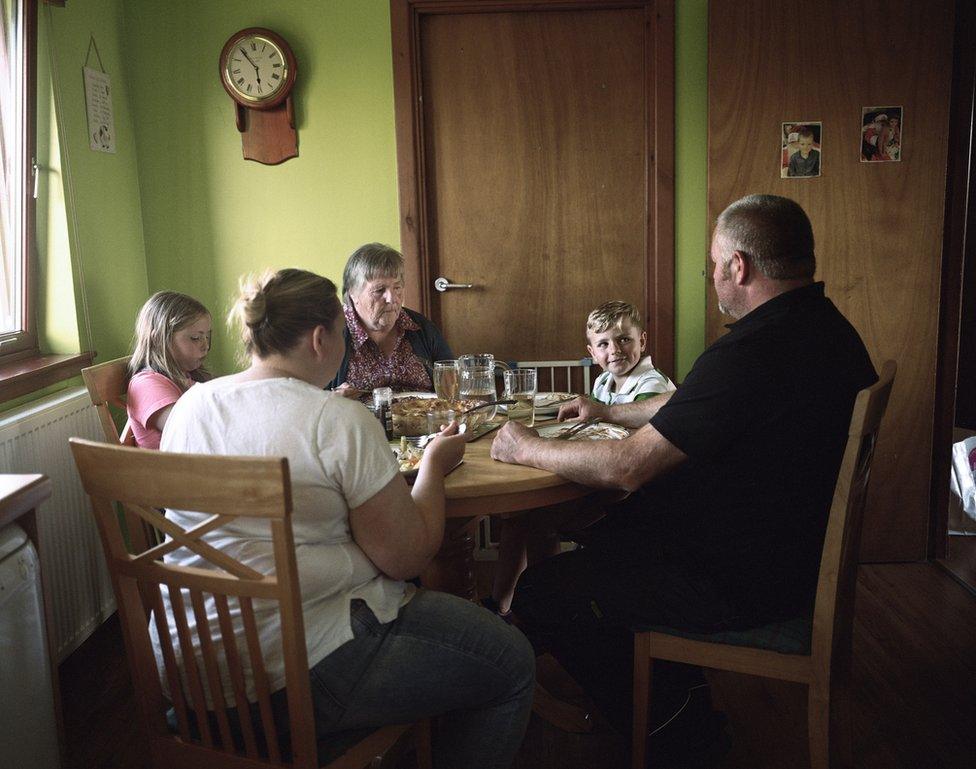 A family talk around their dinner table.