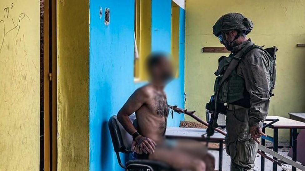 An IDF soldier interrogates a detainee in Gaza