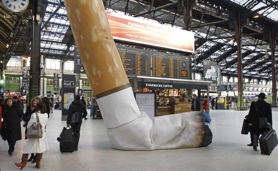 File photo of symbolic cigarette butt inside Gare de Lyon railway station in Paris