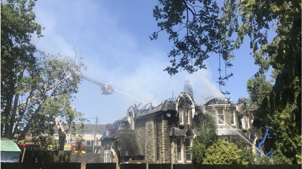 Firefighters extinguish a blaze at Dolgerddon Hall, Rhayader