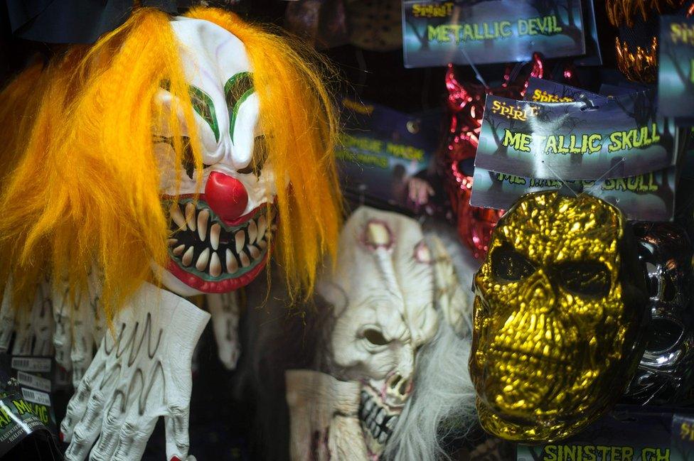 This picture shows Halloween masks on a wall at Spirit Halloween costume store in Easton, Maryland. A series of creepy clown sightings across the US has caused a wave of hysteria