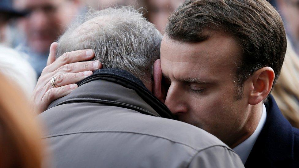 French President Emmanuel Macron gives his condolences to relatives of victims near the Bataclan concert venue during a ceremony marking the second anniversary of the Paris attacks of November 2015 in which 130 people were killed, in Paris, France, 13 November 2017