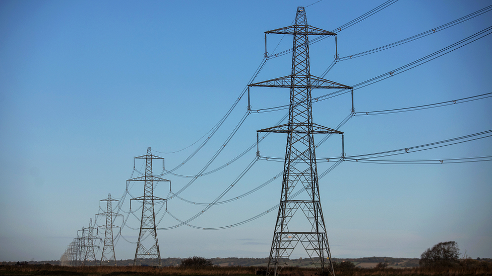 A stock image of electricity pylons in England