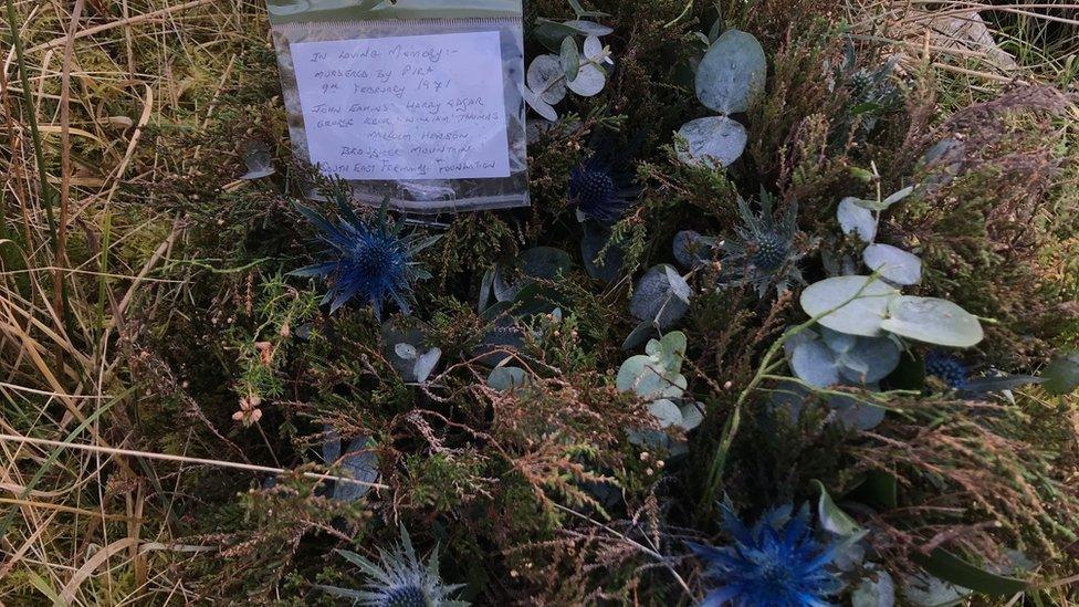 Flowers mark the scene of the explosion 50 years on