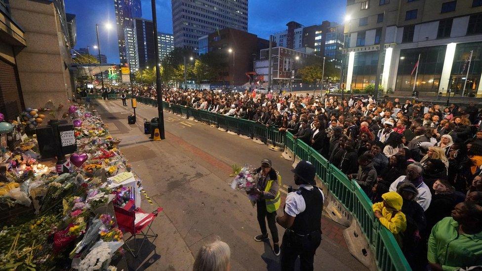 People gather at the vigil