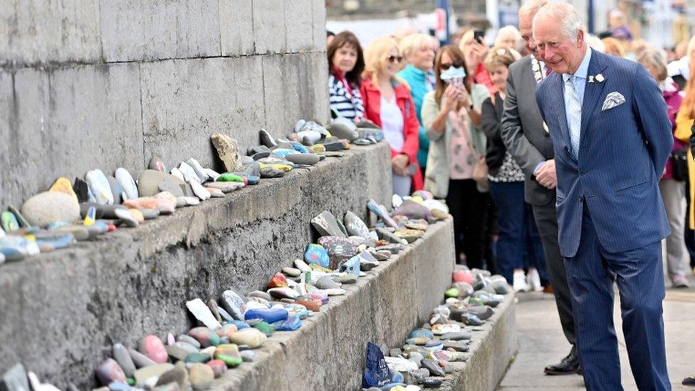 The Prince of Wales during a visit to Donaghadee Harbour where he viewed stones which line the harbour walls and were decorated with messages of hope by local people during the pandemic. The prince also unveiled a plaque to commemorate the Bicentenary of the Royal Charter of Donaghadee Harbour and the laying of the harbour"s foundation stone.