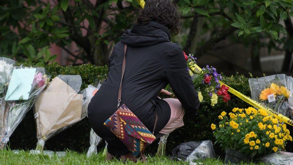 Flowers laid at the site of the mass shooting in a synagogue in Pittsburgh, on 28 October 2018