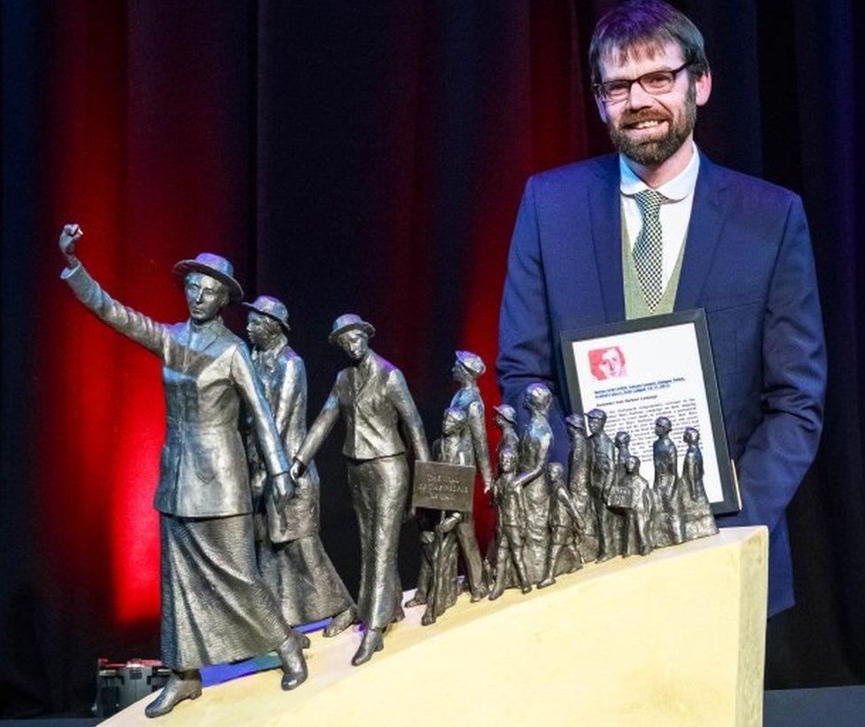 Sculptor Andrew Brown with his winning maquette