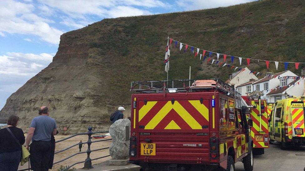 Emergency vehicles on a beach