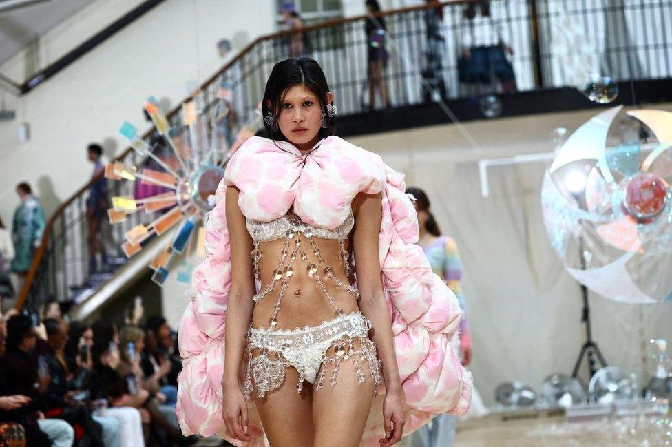 A model presents a creation by London-based designer Susan Fang during the Autumn/Winter 2024 collection catwalk presentation during London Fashion Week in London on February 19, 2024.