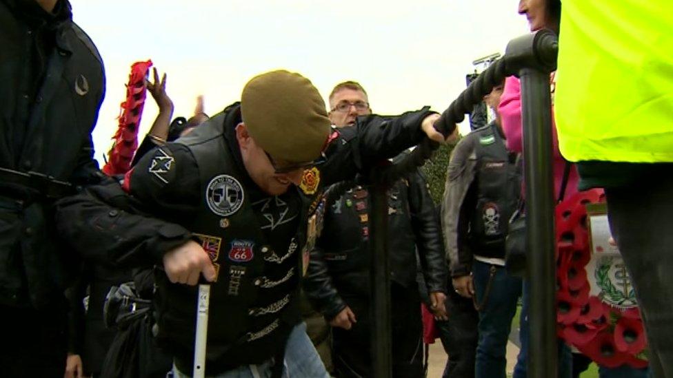 Anthony Cooper climbs the steps to the memorial