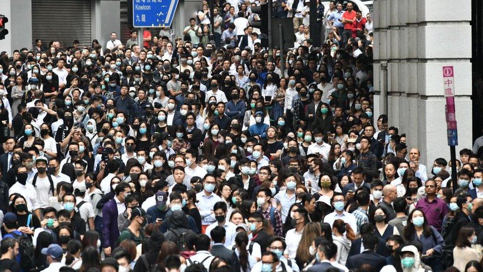 Office-workers-in-Hong-kong-wearing-face-masks.