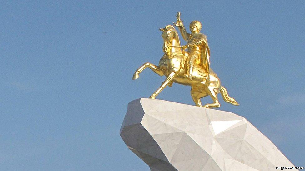 Giant gold statue of President Gurbanguly Berdymukhamedov on a horse